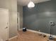Bedroom with laminate floors, a modern light fixture, and colorful walls at 1164 Groff Ave, Indianapolis, IN 46222