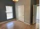 Cozy bedroom with neutral walls and a window for natural light at 1164 Groff Ave, Indianapolis, IN 46222