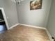 Clean dining area with wood-look floors and open doorway, ready for your personal touch at 1164 Groff Ave, Indianapolis, IN 46222