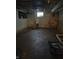 Unfinished basement with concrete walls, a small window, and utilities at 1168 N Gladstone Ave, Indianapolis, IN 46201