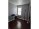 Bedroom with wood floors, table and lamp at 1168 N Gladstone Ave, Indianapolis, IN 46201