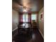A dining room with a wooden table, chairs, and a ceiling fan at 1168 N Gladstone Ave, Indianapolis, IN 46201
