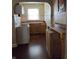 Efficient kitchen layout with ample cabinetry and counter space, ready for updates at 1168 N Gladstone Ave, Indianapolis, IN 46201