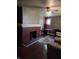 Living room featuring brick fireplace, hardwood floors, and neutral wall colors at 1168 N Gladstone Ave, Indianapolis, IN 46201