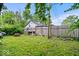 Private backyard with lush green grass, wooden fence, and potential for outdoor enjoyment at 1170 N Concord St, Indianapolis, IN 46222