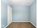 Cozy bedroom featuring plush carpet, fresh paint, and a convenient closet for ample storage at 1170 N Concord St, Indianapolis, IN 46222