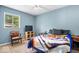 Comfortable bedroom with carpet, an inviting bed and a window bringing in natural light at 1170 N Concord St, Indianapolis, IN 46222