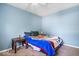 Comfortable bedroom with carpet, an inviting bed and a window bringing in natural light at 1170 N Concord St, Indianapolis, IN 46222