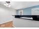 Efficient kitchen space with black granite countertops and a stove-top island at 1170 N Concord St, Indianapolis, IN 46222