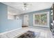 Open-concept living and kitchen area with tile floors and a front door letting in plenty of light at 1170 N Concord St, Indianapolis, IN 46222