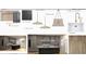 Contemporary kitchen design with stylish lighting, cabinetry, countertops and modern appliances at 120 First Ne Ave, Carmel, IN 46032