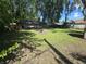 Lush backyard showcasing a gazebo, fire pit, and the home's exterior siding and access point at 1263 Barefoot Trl, Greenwood, IN 46142