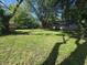 Expansive backyard featuring a gazebo, fire pit, well-kept lawn, and home visible at 1263 Barefoot Trl, Greenwood, IN 46142
