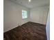 Bright bedroom featuring a window letting in natural light and nice wood floors at 1263 Barefoot Trl, Greenwood, IN 46142
