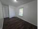 This bedroom features hardwood floors, closet, and neutral walls at 1263 Barefoot Trl, Greenwood, IN 46142