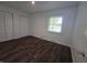 This bedroom features a window letting in natural light and a closet for storage at 1263 Barefoot Trl, Greenwood, IN 46142