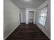 This bedroom features hardwood floors, closet, and neutral walls at 1263 Barefoot Trl, Greenwood, IN 46142
