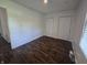 This bedroom has a window, wood floors, and a closet for storage at 1263 Barefoot Trl, Greenwood, IN 46142