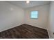 Bright bedroom featuring a window letting in natural light and nice wood floors at 1263 Barefoot Trl, Greenwood, IN 46142