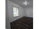 This bedroom features hardwood floors and a window at 1263 Barefoot Trl, Greenwood, IN 46142