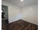 View of bedroom with wood floors and ensuite bathroom with a bathtub at 1263 Barefoot Trl, Greenwood, IN 46142