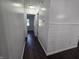 This hallway features hardwood floors and neutral walls at 1263 Barefoot Trl, Greenwood, IN 46142