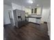 Kitchen with white cabinets, black countertops, and stainless steel appliances at 1263 Barefoot Trl, Greenwood, IN 46142