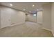 Spacious carpeted basement area with recessed lighting and a window, offering versatility for recreation or storage at 12878 Ari Ln, Fishers, IN 46037