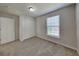 Cozy bedroom with carpet flooring, a double door closet, and a window providing natural light, creating a welcoming space at 12878 Ari Ln, Fishers, IN 46037