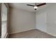 Bedroom featuring plush carpeting, a ceiling fan, and bright window at 12878 Ari Ln, Fishers, IN 46037