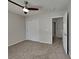 Comfortable bedroom with neutral carpet, a ceiling fan, and a closet, designed for relaxation and convenience at 12878 Ari Ln, Fishers, IN 46037