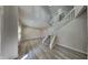 Bright foyer with wood-look floors, a staircase, and high ceilings, creating an open and inviting space at 12878 Ari Ln, Fishers, IN 46037