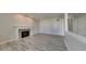Living room with wood-look floors and a fireplace, offering a cozy and inviting atmosphere at 12878 Ari Ln, Fishers, IN 46037