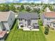A manicured backyard, featuring a patio with a gazebo-covered hot tub, enhances the appeal of this suburban home at 12993 E 131St St, Fishers, IN 46037