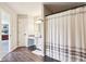 Bright bathroom features a large vanity, granite counters, and a combined shower and walk-in closet at 12993 E 131St St, Fishers, IN 46037
