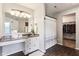 Bright bathroom features a large vanity, granite counters, and a combined shower and walk-in closet at 12993 E 131St St, Fishers, IN 46037