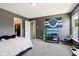 This bedroom offers a cozy retreat with carpet floors, a queen-size bed, and an adjacent walk-in closet at 12993 E 131St St, Fishers, IN 46037