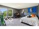 Cozy bedroom with natural light, carpet flooring, and a modern design at 12993 E 131St St, Fishers, IN 46037