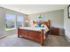 Comfortable bedroom showcasing a bed, two windows and carpeted floors at 12993 E 131St St, Fishers, IN 46037