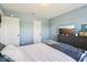 This carpeted bedroom features a queen-size bed and TV, offering a relaxing and private retreat at 12993 E 131St St, Fishers, IN 46037