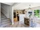 Eat-in dining area, stairs, and kitchen with modern décor, a large sunny window, and an open concept design at 12993 E 131St St, Fishers, IN 46037
