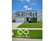 Charming two-story home with well-manicured lawn, lovely landscaping, covered front porch, and attached two-car garage at 12993 E 131St St, Fishers, IN 46037