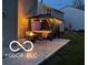 A gazebo with a hot tub enhances the backyard, offering a tranquil retreat with evening illumination at 12993 E 131St St, Fishers, IN 46037