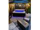 Inviting hot tub with a gazebo, string lights, fire pit, and comfortable seating for relaxing evenings outdoors at 12993 E 131St St, Fishers, IN 46037