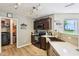Updated kitchen features stainless steel appliances, dark cabinets, and modern finishes at 12993 E 131St St, Fishers, IN 46037
