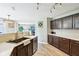 Updated kitchen features stainless steel appliances, modern lighting, and an open layout at 12993 E 131St St, Fishers, IN 46037