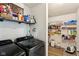 Well-organized laundry room with modern washer, dryer, storage and a pantry at 12993 E 131St St, Fishers, IN 46037