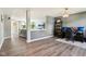 Spacious open-concept living area with gray walls, stylish gray flooring, neutral furniture, and an open floor plan at 12993 E 131St St, Fishers, IN 46037