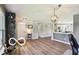 Bright and open living room area with modern decor, hard surface flooring, and ample lighting at 12993 E 131St St, Fishers, IN 46037