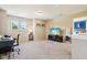 Versatile upper level loft with a desk, TV, and cozy carpeting, great for relaxing at 12993 E 131St St, Fishers, IN 46037